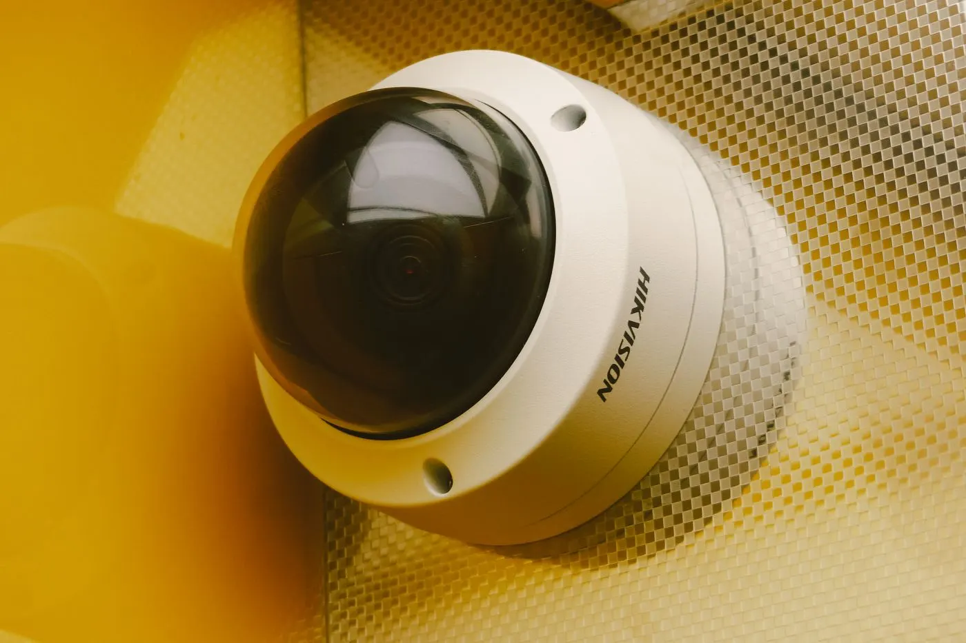 Close-up of a ceiling-mounted dome security camera